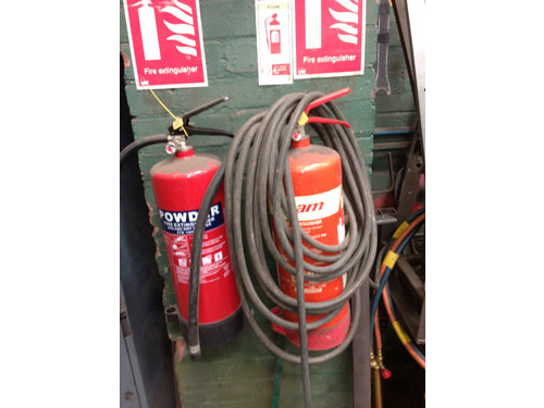 fire-extinguisher-blocked-by-hose